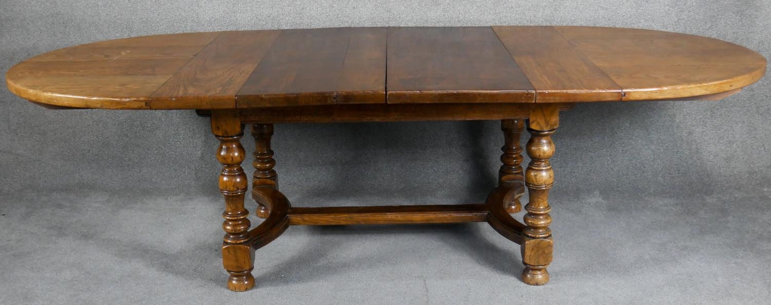 An antique style Ipswich oak extending dining table with two extra leaves on baluster turned - Image 5 of 7