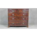 A Georgian flame mahogany bowfronted chest on swept bracket supports. H98 W107 D54cm