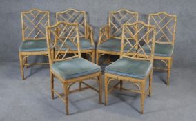 A set of six bamboo style dining chairs, to include two carver armchairs.