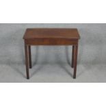 A Georgian mahogany foldover top tea table with gateleg action on square supports. H.71 W.81 D.40