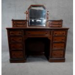 A 19th century Continental walnut, ebonised and inlaid dressing table with bevelled swing mirror
