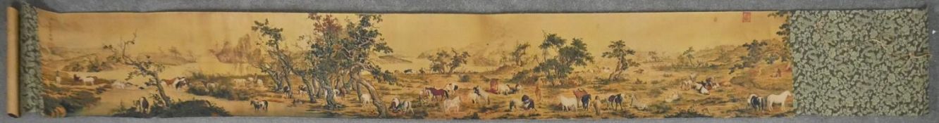 A printed Chinese scroll of a landscape with horses. L.264 W.34cm
