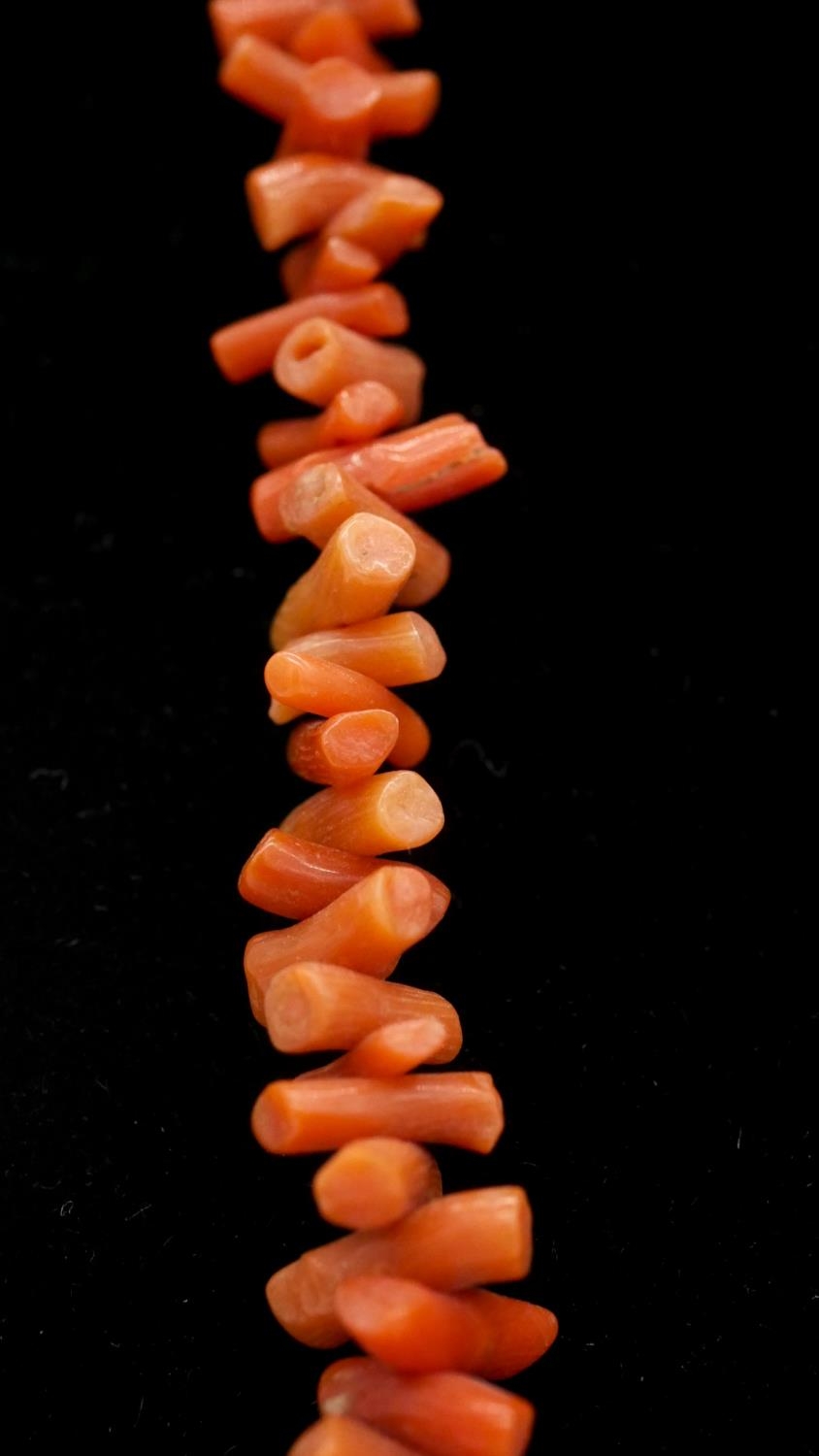 Two coral necklaces. One comprising of graduated sections of red branch coral and polished round - Image 7 of 8