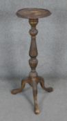 A Georgian style carved mahogany torchere on tripod cabriole supports. H92cm