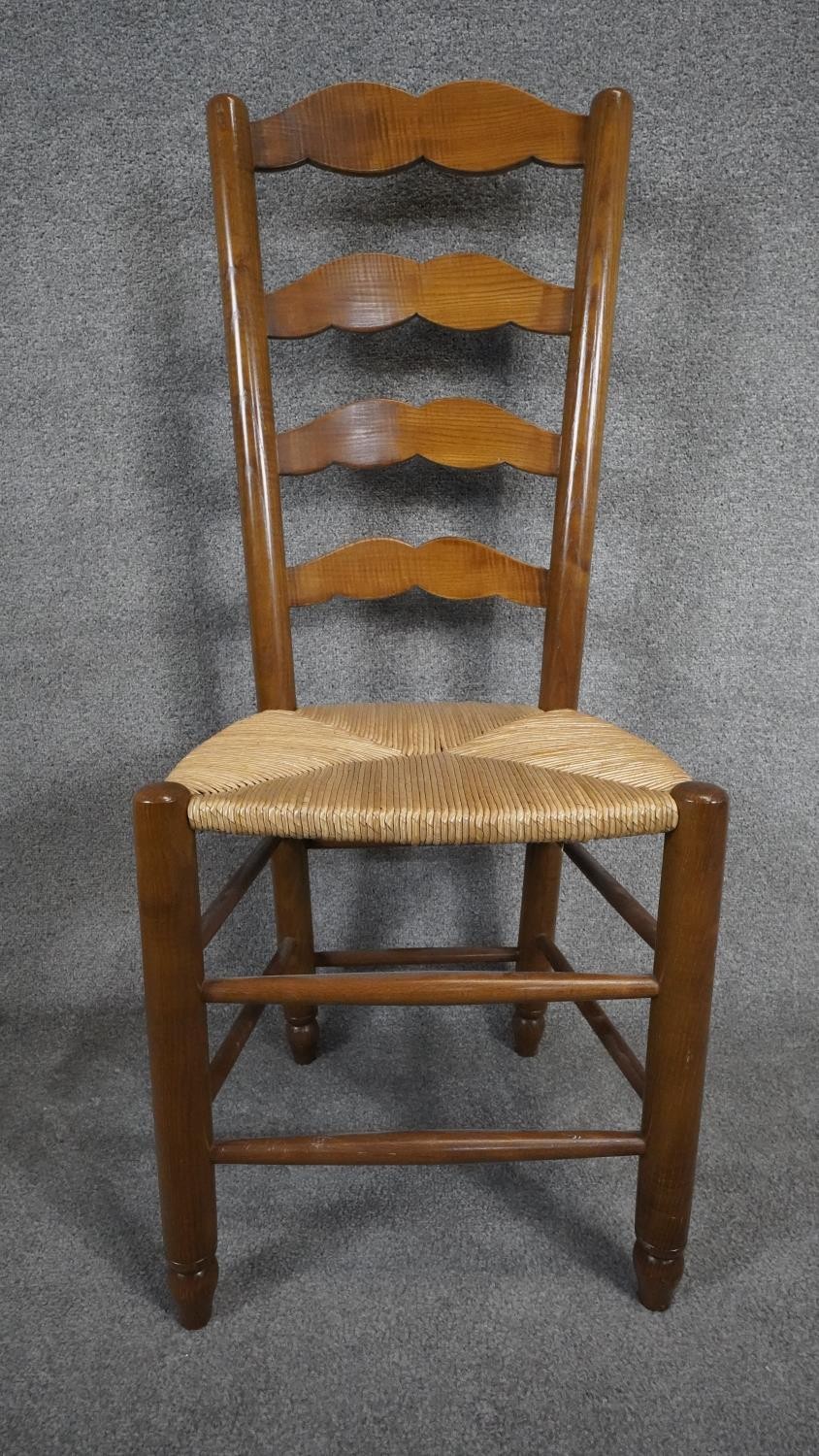 A set of five antique style country ladder back dining chairs with rush seats on stretchered - Image 2 of 4
