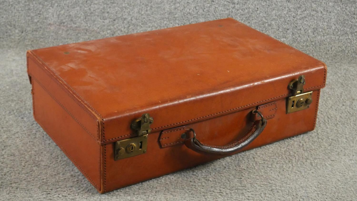 Two antique tan leather suitcases with brass fittings. One filled with curiosities from around the - Image 2 of 6