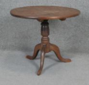 A Georgian oak tilt top occasional table on tripod cabriole supports. H50 D60cm