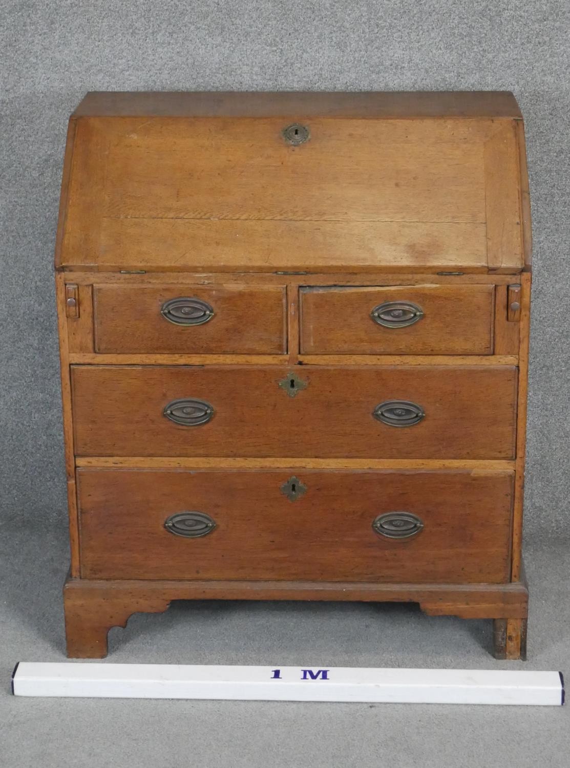 A 19th century country oak bureau with fitted interior. H98 W84 D50