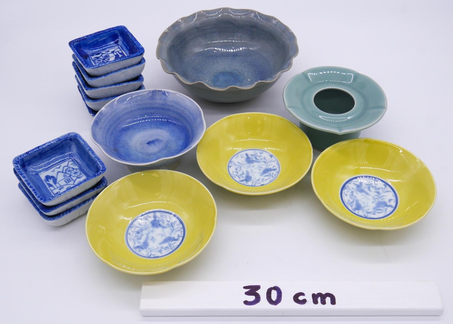 A collection of Oriental glazed ceramics. Including a celadon glaze flower form pot and set of eight - Image 7 of 7