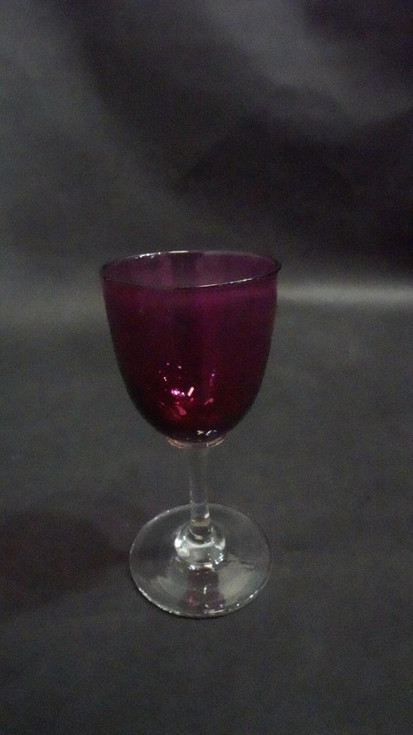 Three Victorian cranberry glass wine glasses along with a pair of antique petal facet liqueur - Image 7 of 8