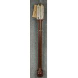 A 19th century stick barometer with silvered scale plate and mahogany case with bulbous cistern