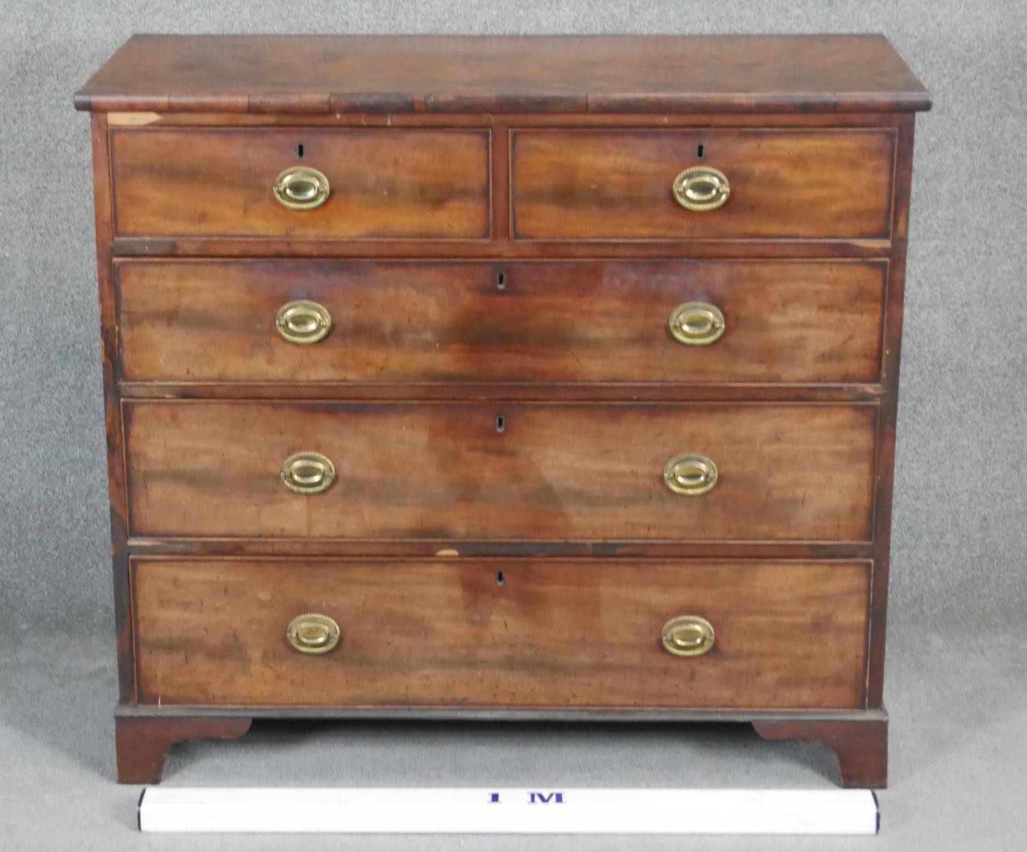 A Georgian mahogany chest with brass oval plate handles on shaped bracket feet. H98 W110 D48 - Image 2 of 3