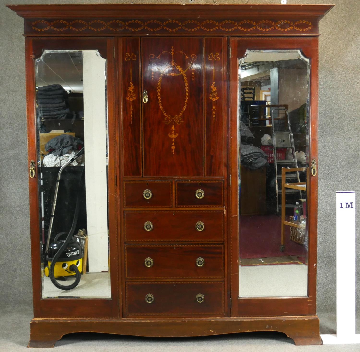 A C.1900 mahogany triple section compactum wardrobe with satinwood scrolling foliate, ribbon and - Image 9 of 9