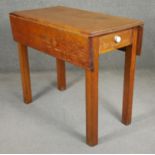 A C.1900 beech drop leaf table. H.76 W.44 W.87 D.90cm