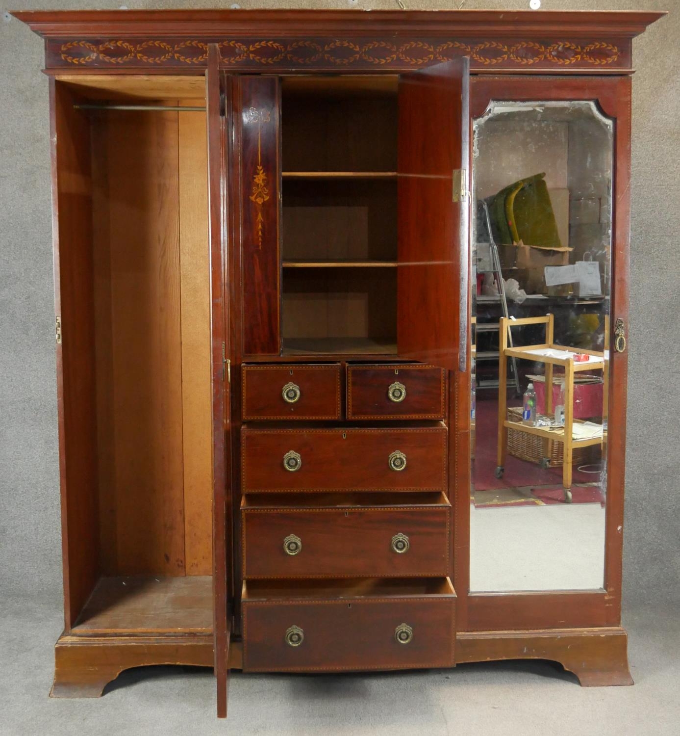 A C.1900 mahogany triple section compactum wardrobe with satinwood scrolling foliate, ribbon and - Image 4 of 9