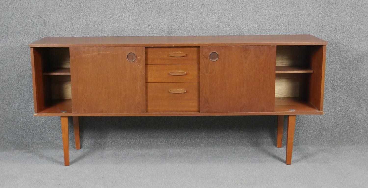 A vintage teak Avalon sideboard with cupboards and drawers on square tapering splay supports. H71 - Image 2 of 5