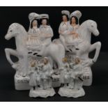 A pair of 19th century Staffordshire flatback figures of a couple on a horse 'Returning Home' and '