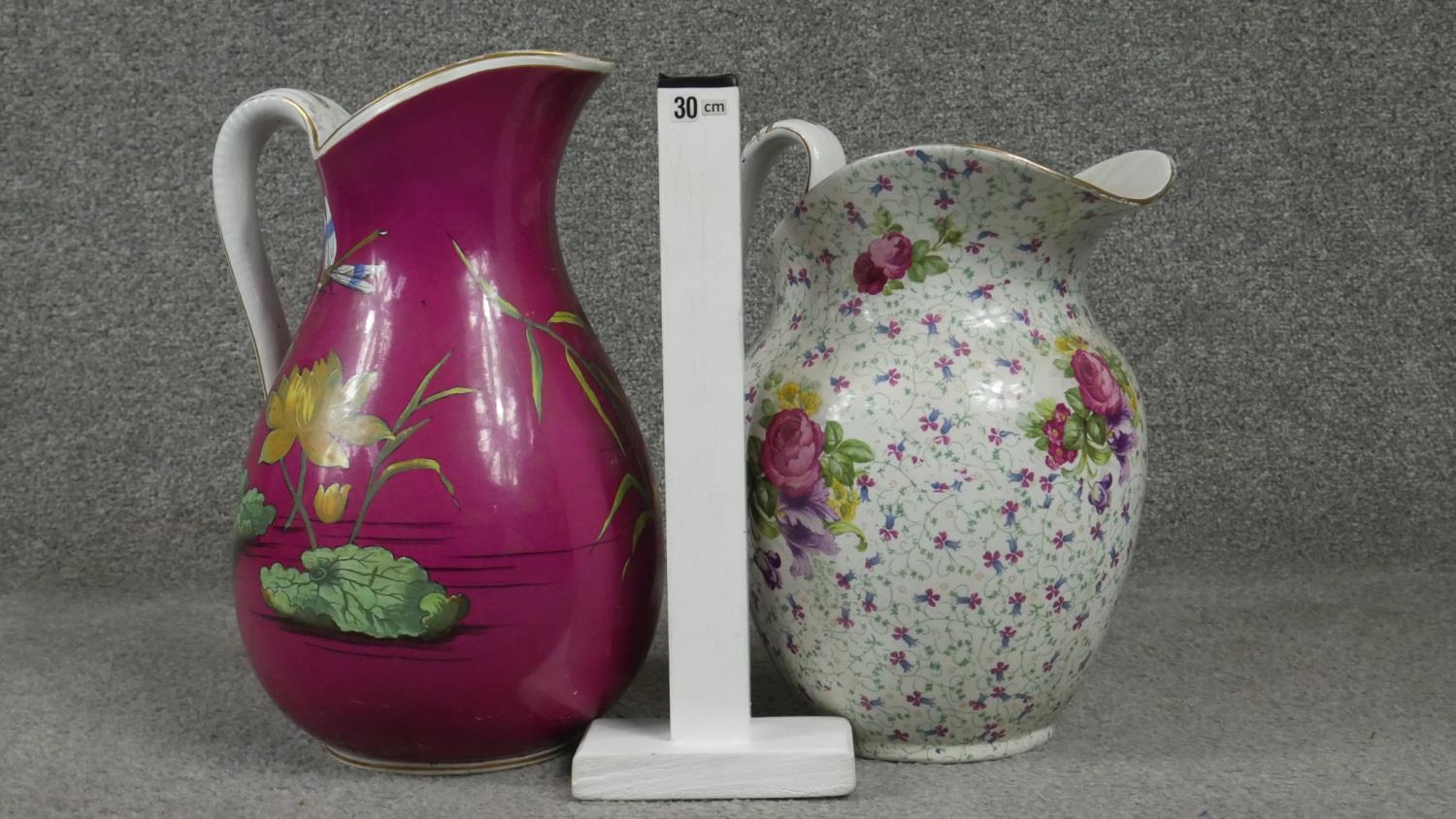 Two Victorian ceramic wash jugs. One with a fuscia ground and decorated with waterlillys and - Image 6 of 6