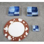 A Shiseido design Angela Cummings dinner plate along with three glazed ceramic dishes with quartered