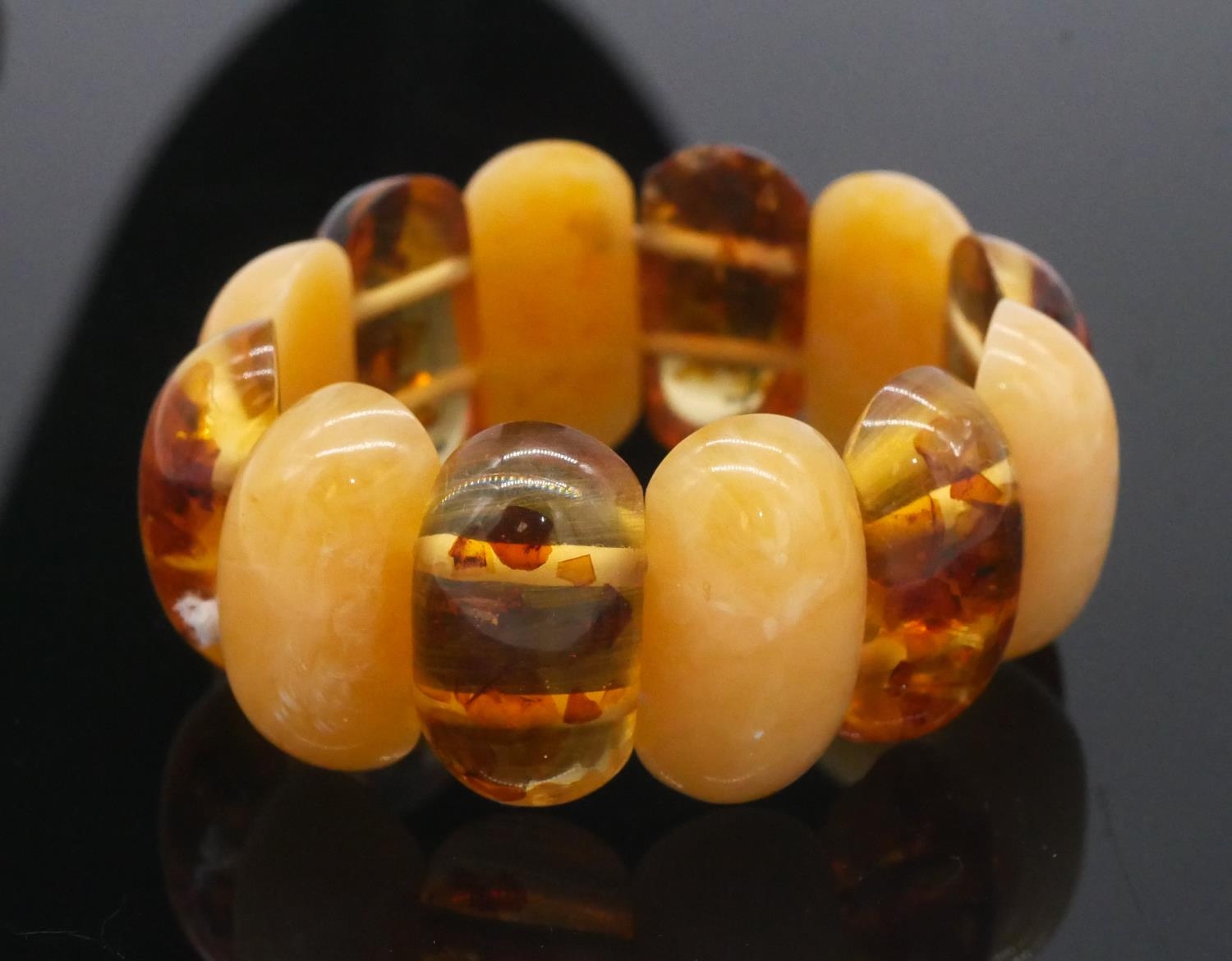An amber bead elasticated bracelet along with a graduated amber drop necklace with scrolling - Image 5 of 6