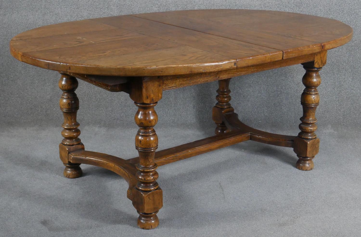 An antique style Ipswich oak extending dining table with two extra leaves on baluster turned - Image 2 of 7