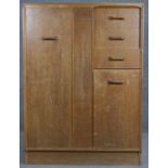 A mid century teak G-Plan compactum wardrobe with maker's stamp. H.122 W.88 D.46cm