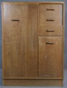 A mid century teak G-Plan compactum wardrobe with maker's stamp. H.122 W.88 D.46cm