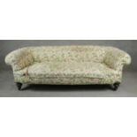 A Victorian Chesterfield sofa on turned walnut feet, in need of re upholstery. H.65 W.190 D.80cm