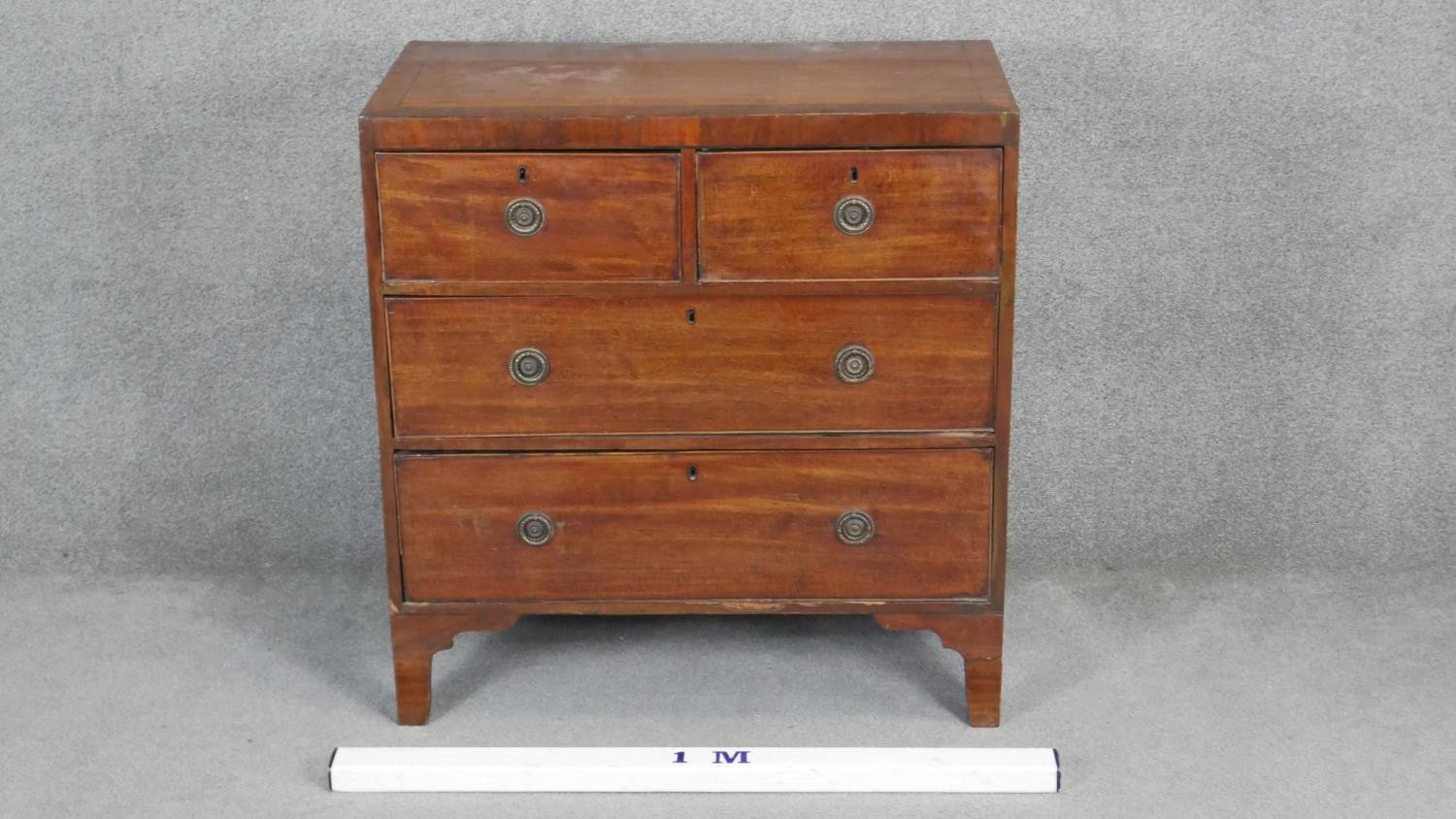 A small Regency mahogany chest of two short above two long drawers on bracket feet. H90 W87 D47cm - Image 2 of 3