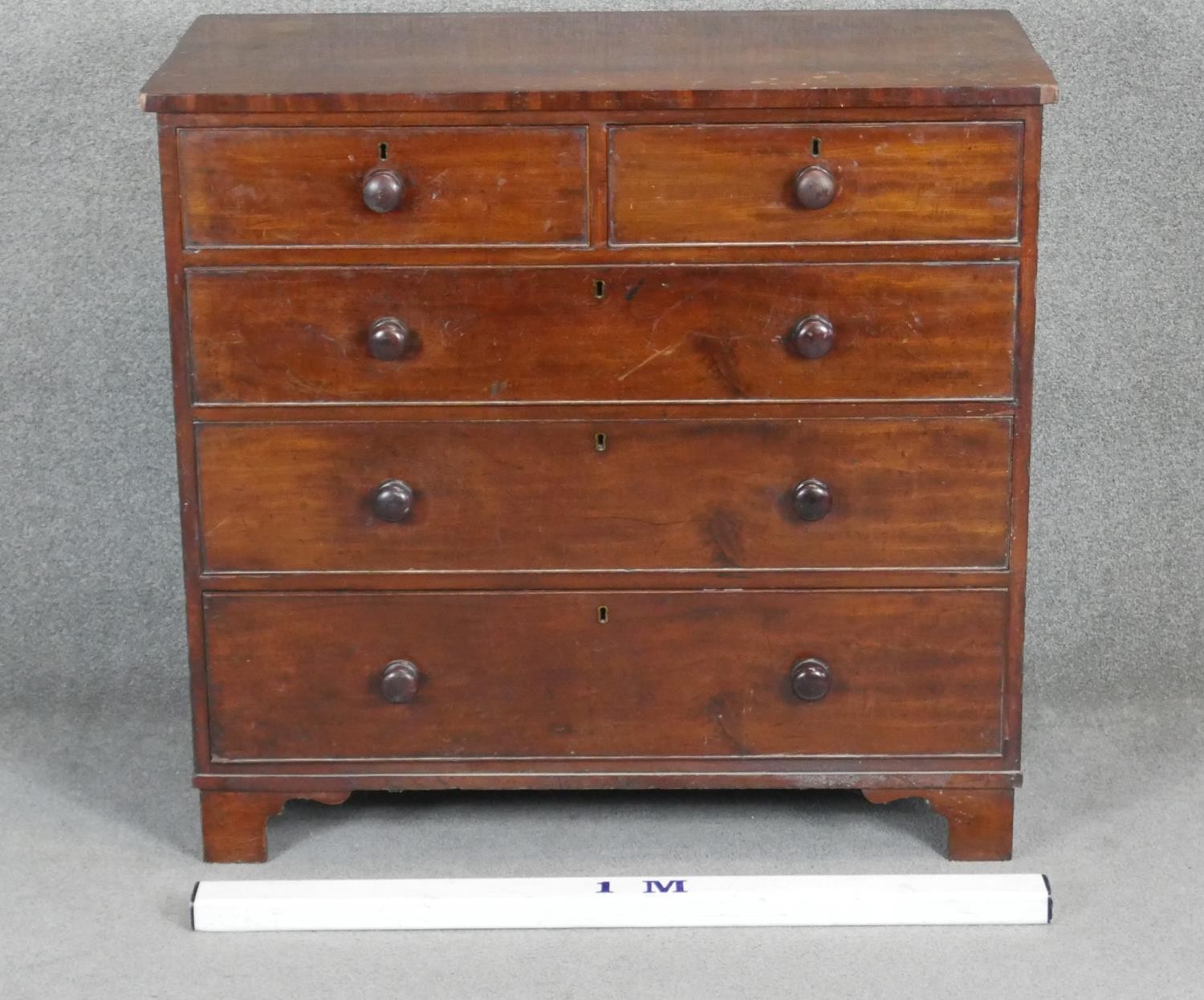 A 19th century mahogany chest with turned knob handles on shaped bracket feet. H97 W103 D50 - Image 2 of 3