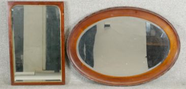 A 19th century mirror in mahogany frame with gilt slip and a vintage oval mirror.
