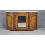 A Victorian burr walnut and satinwood Arabesque inlaid credenza with marble top above cupboards on