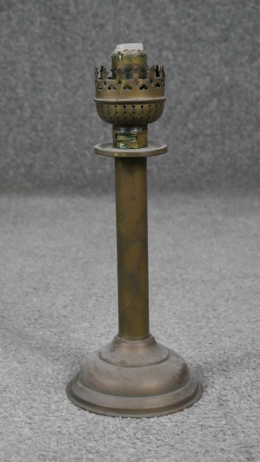 Four antique brass oil lamps one with an etched globe shade. H.54cm - Image 3 of 6