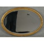 A 19th century gilt wood and gesso wall mirror in reeded and gadrooned frame. H.62 W.86cm