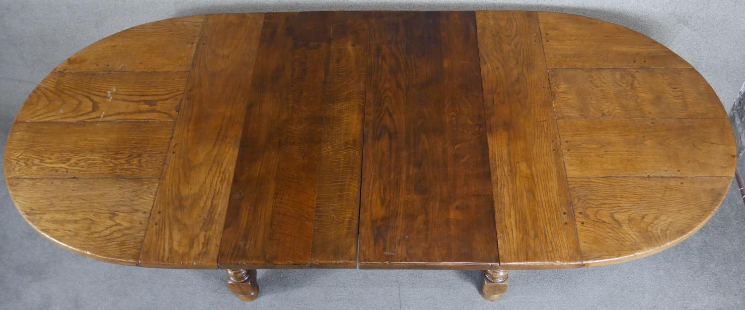 An antique style Ipswich oak extending dining table with two extra leaves on baluster turned - Image 6 of 7