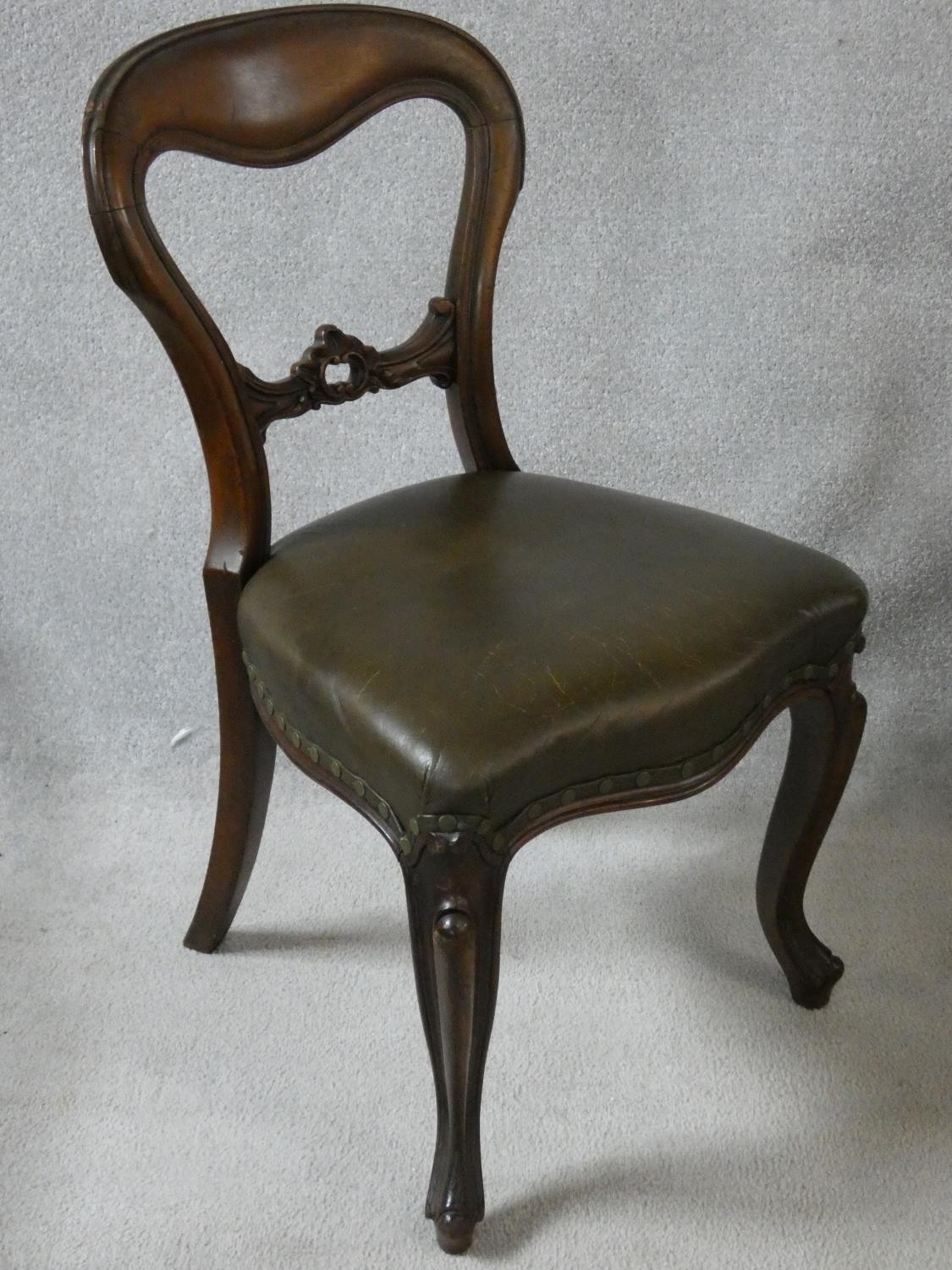 A set of four mid Victorian mahogany balloon back dining chairs with deep green leather stuffover - Image 2 of 4