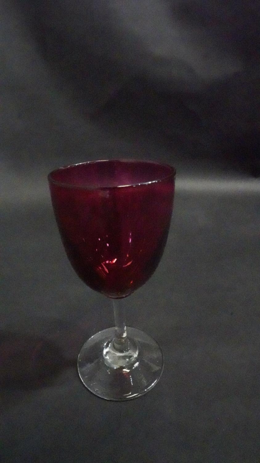 Three Victorian cranberry glass wine glasses along with a pair of antique petal facet liqueur - Image 2 of 8
