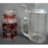 A Bohemian ruby flash glass lidded jar with vine design along with a cut crystal glass lidded