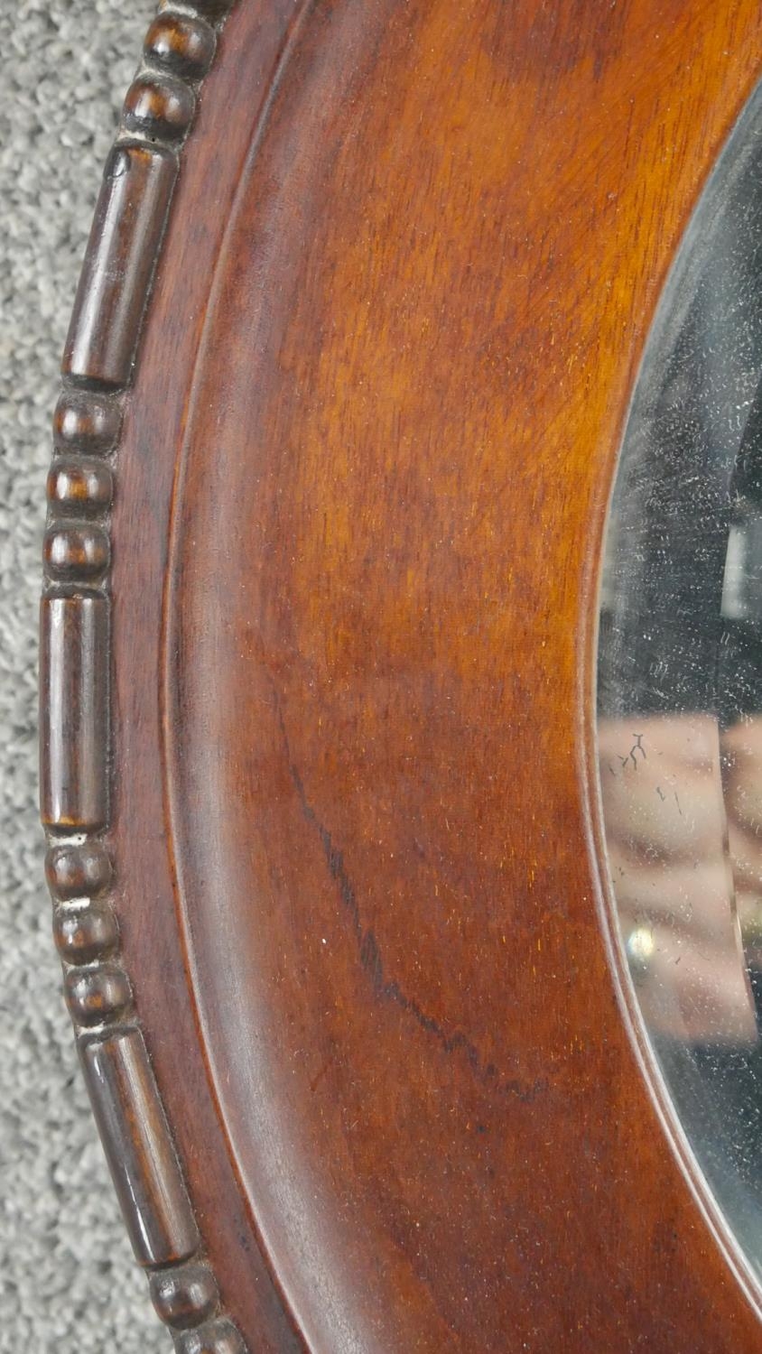 A 19th century mirror in mahogany frame with gilt slip and a vintage oval mirror. - Image 5 of 6