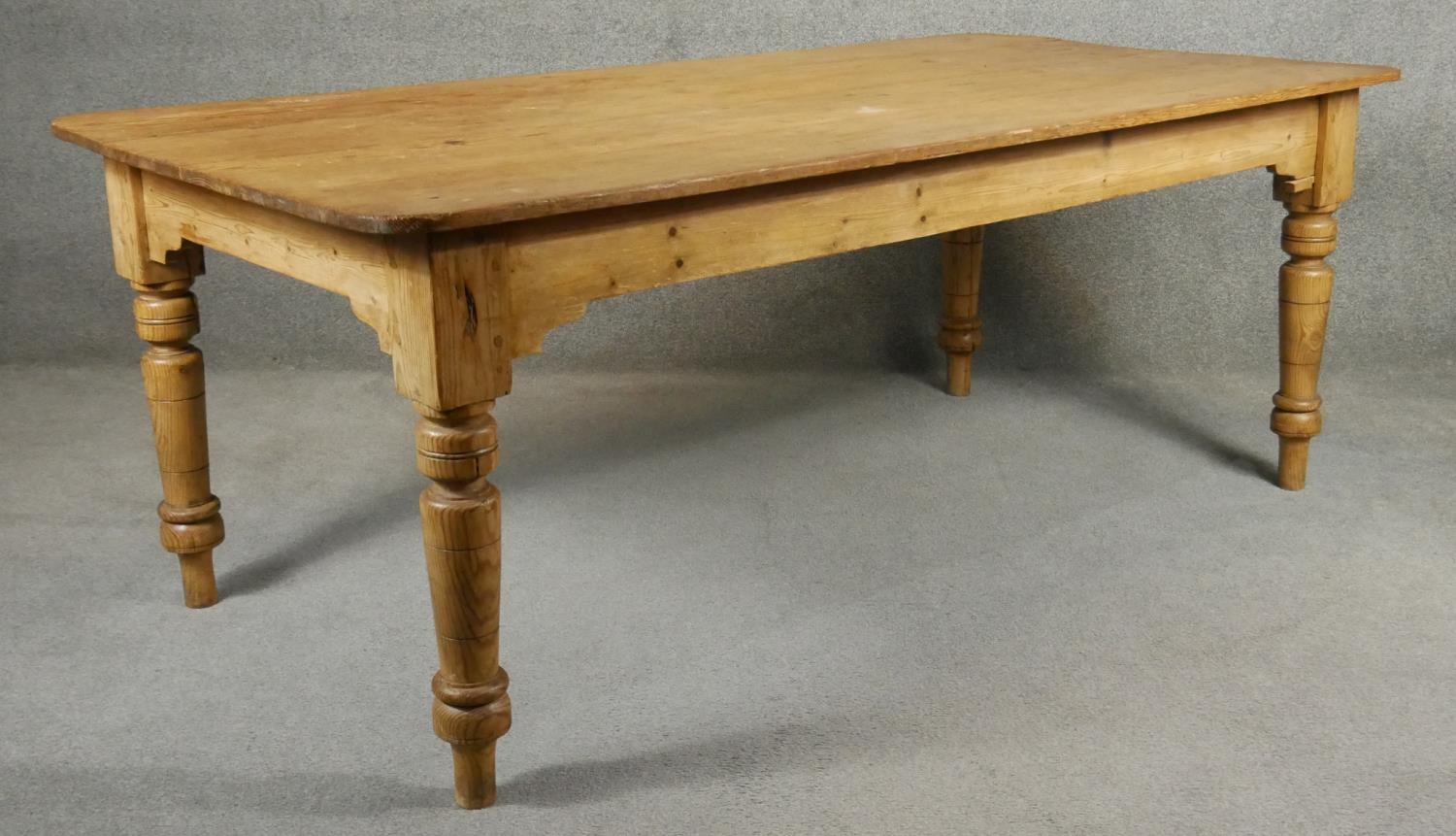 A 19th century pitch pine planked top farmhouse refectory style dining table on turned tapering - Image 2 of 5