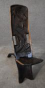 An African carved hardwood two part palaver chair with relief alligator detailing. H.80x20cm