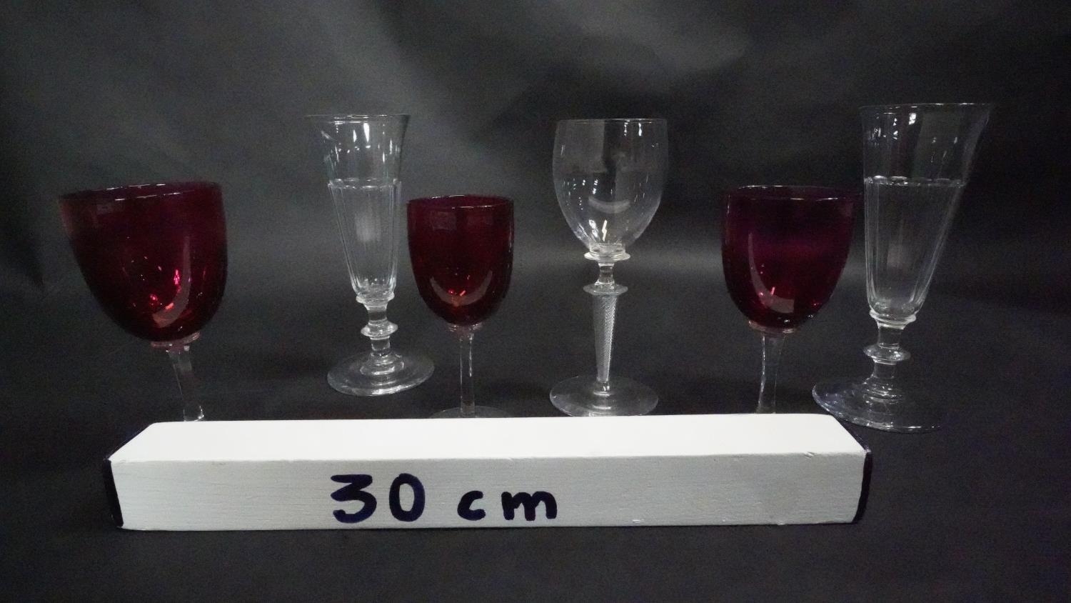 Three Victorian cranberry glass wine glasses along with a pair of antique petal facet liqueur - Image 8 of 8