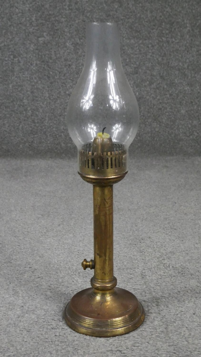 Four antique brass oil lamps one with an etched globe shade. H.54cm - Image 5 of 6