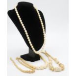 Two Victorian carved graduated ivory bead necklaces along with two Indian pierced bone bead