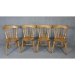 A set of four late 19th century bar back kitchen chairs with elm seats.