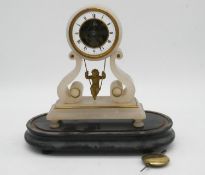 A 19th century French alabaster 8 day swinging cherub mantel clock on ebonised base with pendulum.