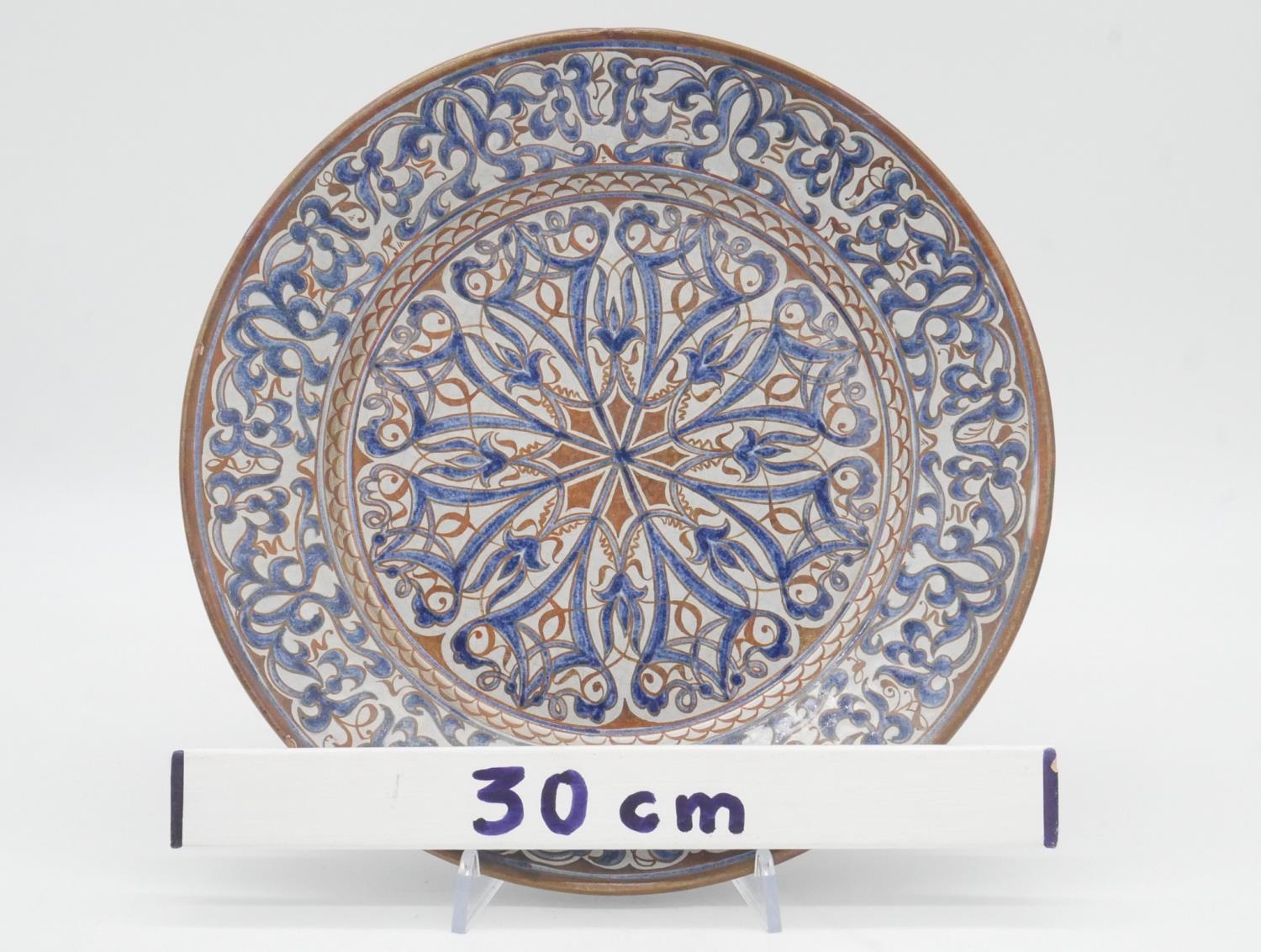 Two Islamic and Greek hand painted plates with a stylised floral design, signed to back. D.31cm - Image 8 of 8