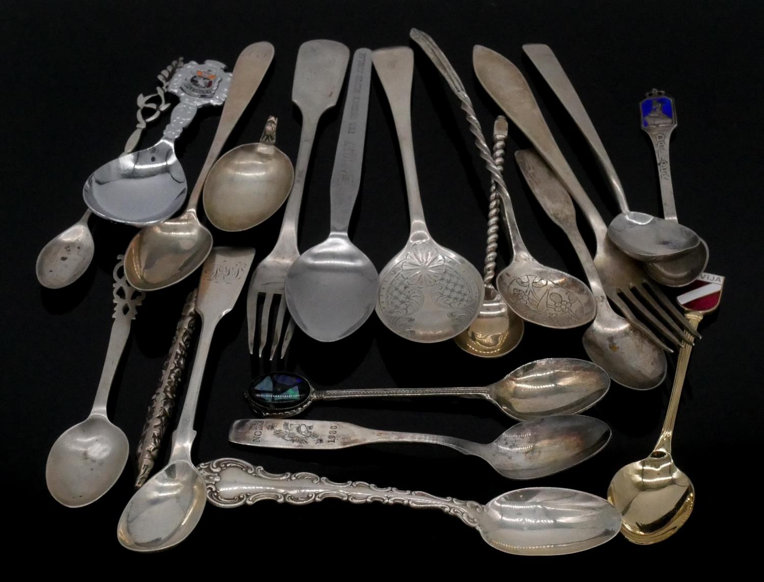 A collection of silver and silver plate cutlery. Including two Russian silver cake forks, a