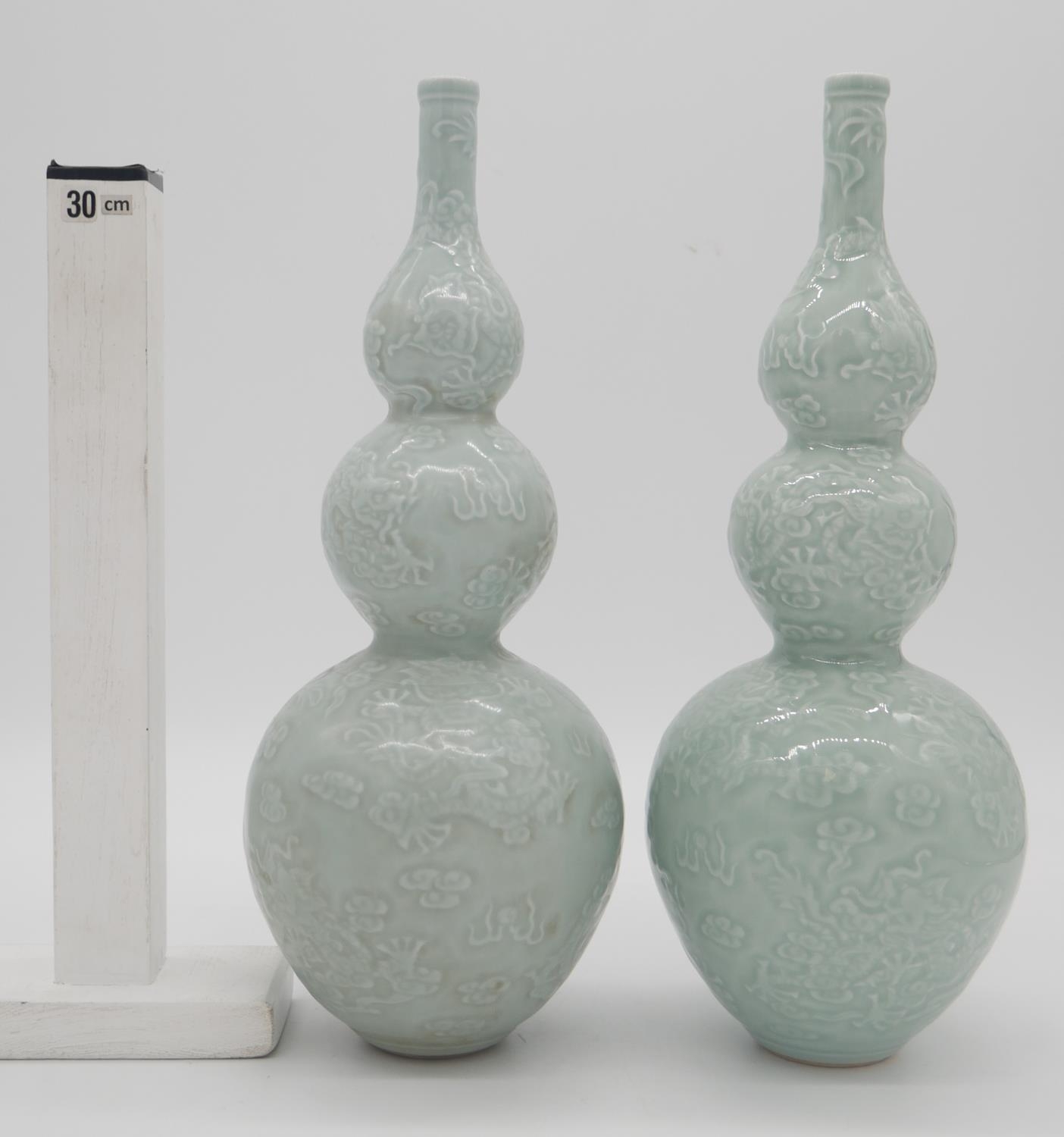 A pair of Chinese green celadon glaze dragon design triple gourd vases. Qianlong mark to the - Image 2 of 5