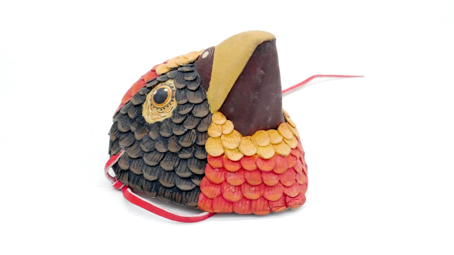 A painted leather bird's head, a vintage singing bakelite carousel cigarette dispenser and a panel - Image 5 of 7